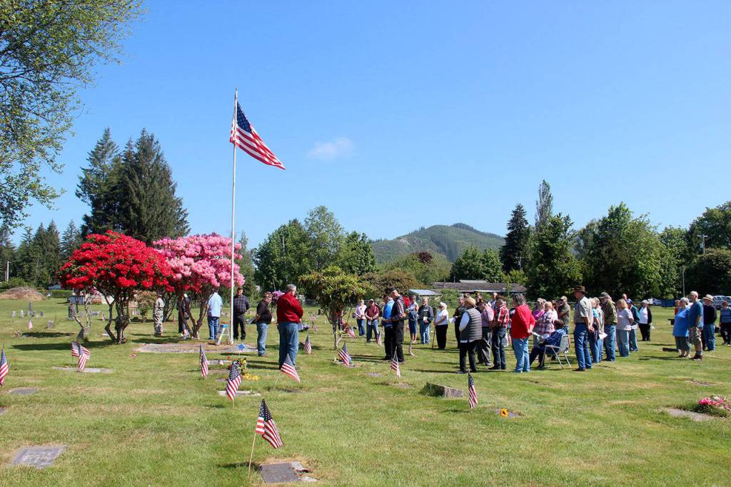 Members of the Veterans of Foreign Wars Fletcher-Wittenborn Post 9106 and American Legion Post 106 held the annual Memorial Day ceremony at the Forks Cemetery on Monday. VFW Post Commander Tom Hughes welcomed about 60 people to the event. (Christi Baron/Olympic Peninsula News Group)