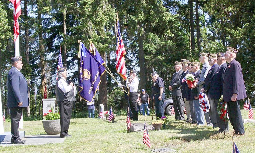 American Legion Post 62, Veterans of Foreign Wars Post 4760 and Veterans of Foreign Wars Post 6787 held a joint Memorial Day ceremony Monday at the Sequim View Cemetery. Several wreaths were placed at the main flagpole, retired Coast Guardsman Rick McKenzie played Amazing Grace on the bagpipes and Paul Renick played taps to end the ceremony. Veterans from World War II and the Korean War attended. (Dave Logan/for Peninsula Daily News)