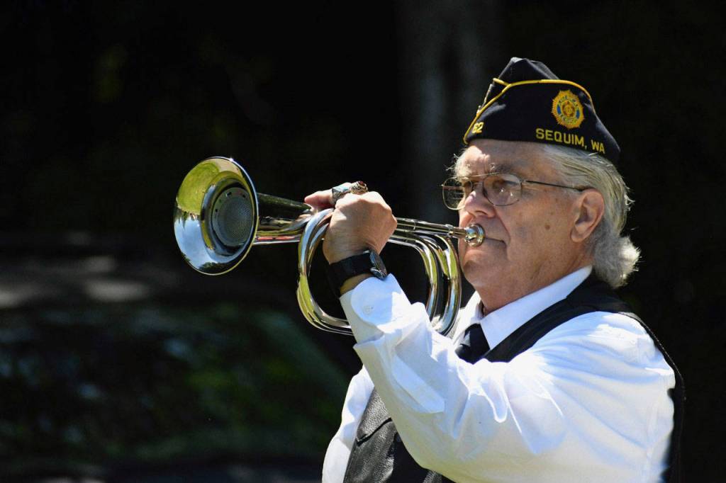 Veteran Carl Bradshaw of VFW Post 4760 in Sequim plays taps at the Gardiner Cemetery Memorial Day ceremony on Monday. (Jeannie McMacken/ Peninsula Daily News)