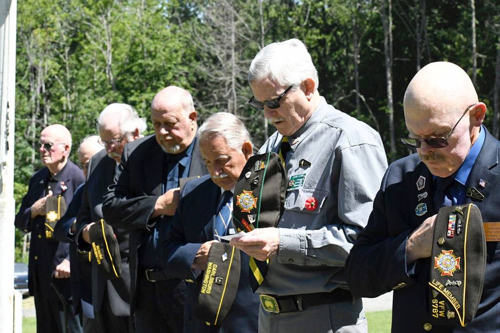 Chaplain John Dowd offers a prayer during the Memorial Day ceremony at the Gardiner Cemetery on Monday. About 30 people attended the event that including wreath-laying and military music. (Jeannie McMacken/Peninsula Daily News)