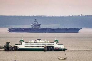 PHOTO: USS Nimitz journeys through the Admiralty Inlet