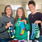 $1,000 worth of socks donated to Caring for Kids