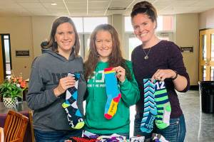 $1,000 worth of socks donated to Caring for Kids