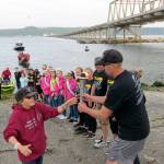 The Special Olympics torch was passed from Jefferson County to Kitsap County torch bearers at Shine Tidelands State Park on Wednesday. The flame was carried across Hood Canal on a Port Gamble SKlallam Tribe canoe.