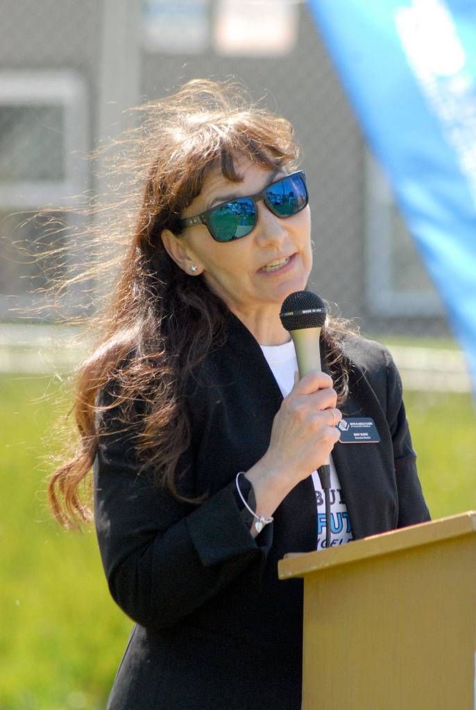 Mary Budke, CEO of the Boys & Girls Clubs of the Olympic Peninsula, talks about the organization during a ceremony Friday to break ground for a new Port Angeles club facility. (Keith Thorpe/Peninsula Daily News)