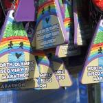 Keith Thorpe/Peninsula Daily News Medals hang at the finish line for children taking part in Saturdays Kids Marathon