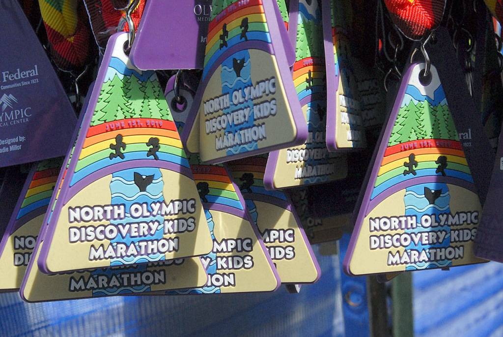 Keith Thorpe/Peninsula Daily News Medals hang at the finish line for children taking part in Saturdays Kids Marathon