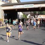 Dave Logan/for Peninsula Daily News Runners take off at the start of the North Olympic Discovery Marathon early Sunday morning. In the lead is Mikey Cobb of Sequim, who won the race two-and-a-half hours later. To the right is Derek Lactaoen of Seattle, who finished second.