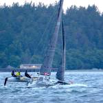 Team Pear Shaped Racing sails in the Race to Alaska on Monday morning. (Jesse Major/Peninsula Daily News)