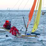 Team Holopuni sails during the first leg of the Race to Alaska Monday morning. (Jesse Major/Peninsula Daily News)