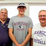 From left, Byron Wilson, Quilcene assistant head football coach Byron Wilson, Robert Comstock III and head football coach Trey Beathard were at Comstocks signing last week to play football at College of the Siskiyous in Weed, Calif.