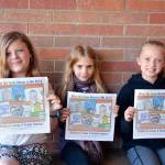 Contest grand-prize winners display their posters, from left, Dylann Christensen, Stella Fradkin and Layla Parker. (Patsene Dashiell/Port Angeles School District)