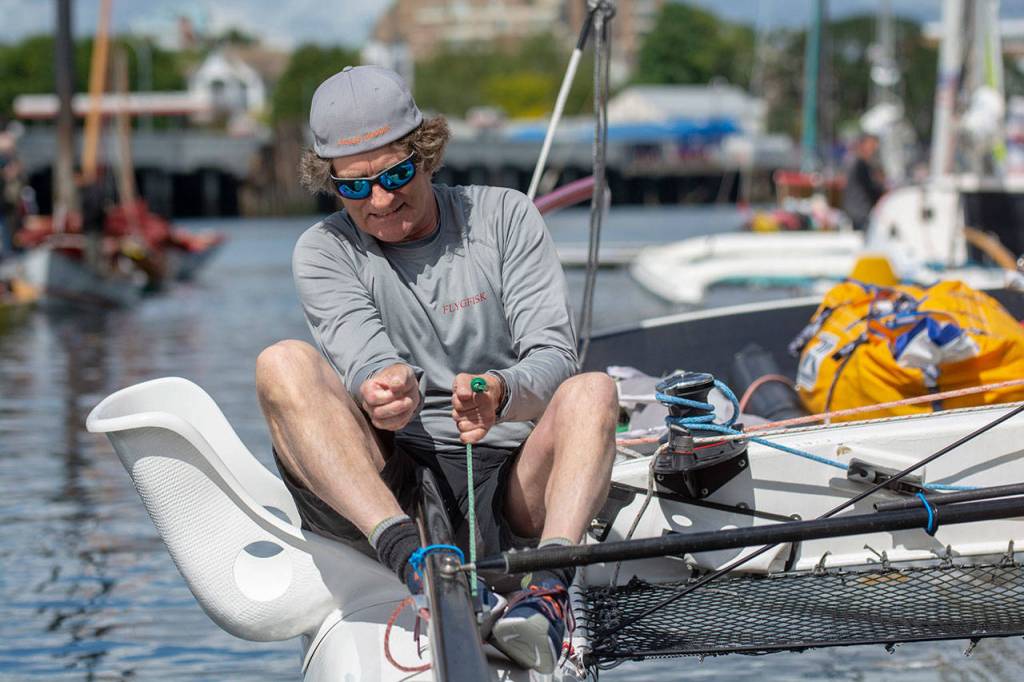 Tom Kassberg of Team Pear Shaped Racing prepares for the Race to Alaska on Thursday. (Jesse Major/Peninsula Daily News)