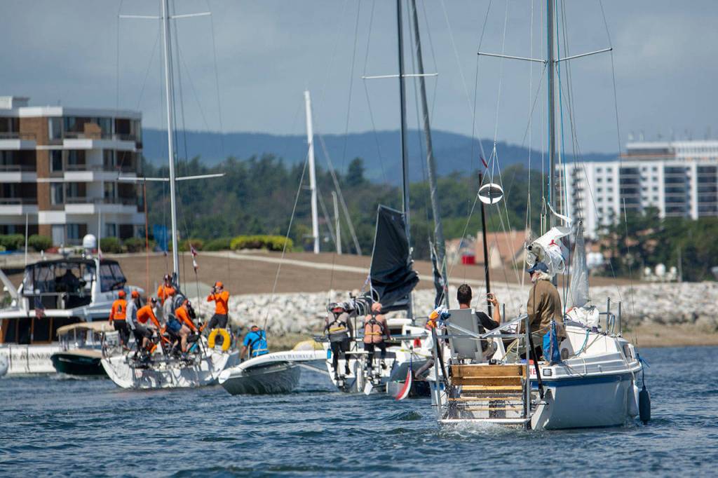 Teams competing in the Race to Alaska make their way through Victorias Inner Harbour on Thursday. (Jesse Major/Peninsula Daily News)
