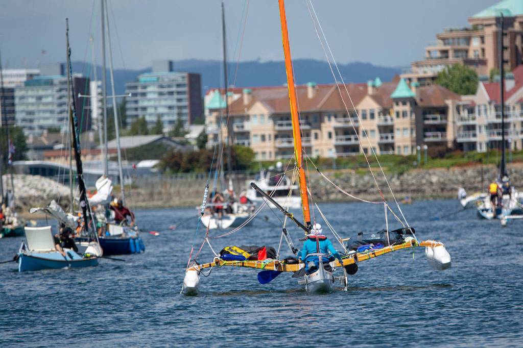Team Holopuni makes its way through Victorias Inner Harbour at the start of the second leg of the Race to Alaska on Thursday. (Jesse Major/Peninsula Daily News)