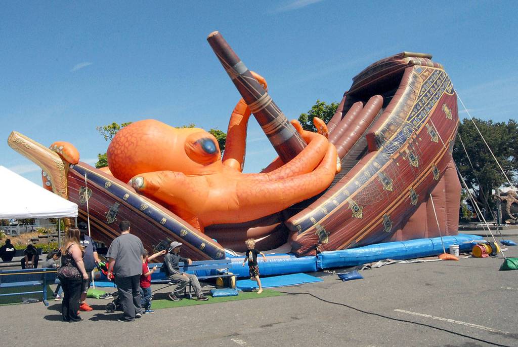 A kraken-themed inflatable slide draws the attention of youngsters at Saturdays Port Angeles Maritime Festival. (Keith Thorpe/Peninsula Daily News)