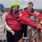 Team Angry Beaver rings the bell Monday afternoon as the winners of the 750-mile Race to Alaska, which began in Port Townsend on June 3. (Charley Starr)