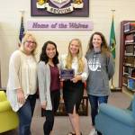 After raising $6,000 for new furnishings under the Robby Streett Legacy Fund, new tables, chairs and coffee tables went into the Sequim High School library. There for the installation are, from left, Josslyn Streett, Lesae Pfeffer, Annabelle Armstrong, and Linsay Rapelje, SHS librarian. (Matthew Nash/Olympic Peninsula News Group)