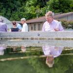 Clallam County Commissioner Randy Johnson inspects eelgrass growing at the Pacific Northwest National Laboratorys Marine Sciences Laboratory in Sequim. (Jesse Major/Peninsula Daily News)