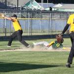 No. 11 Sean Lyman of the Laurel Lanes team slides safely into third base on a wild pitch from #16 Kaleb Mullen the pitcher. The third baseman for Elks is Joseph Ritchie taking the throw.