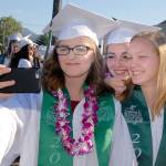 Port Angeles High School seniors, from left, Veronica Kennedy, Sadie Hall and Emily Olson pose for a selfie prior to commencement ceremonies Friday at Civic Field. More than 230 students were scheduled to become part of the Class of 2019. (Keith Thorpe/Peninsula Daily News)