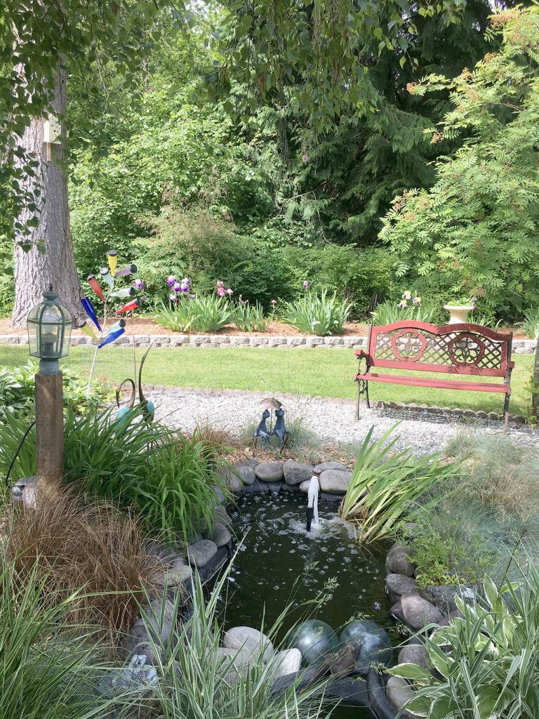 This Petals and Pathways garden offers a place to rest while enjoying the scenery.