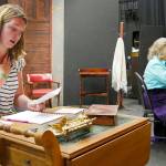 Kait Saffold, left, and Sharon DelaBarre read through the letters they transcribed by hand from the script on a set under construction. (Olympic Theatre Arts)