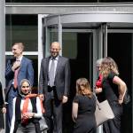 Matt Adams, center right, legal director of the Northwest Immigrant Rights Project, leaves the U.S. Courthouse with others after a hearing on asylum seekers Friday in Seattle. (Elaine Thompson/The Associated Press)