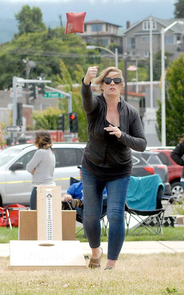 Shannon Cosgrove of Port Angeles tosses a bean bag during Thursdays Independence Day cornhole tournament at Pebble Beach Park in Port Angeles. (Keith Thorpe/Peninsula Daily News)