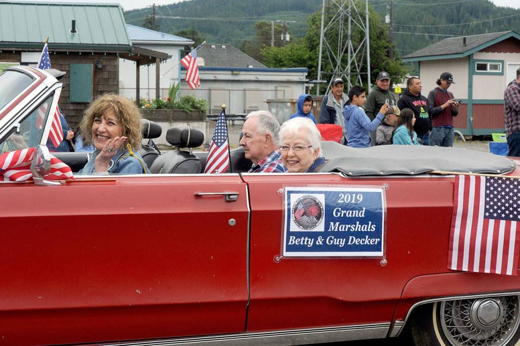 Forks Old Fashioned 4th of July parade grand marshals Guy and Betty Decker of Forks are driven in Thursdays parade by Forks Forum Editor Christi Baron. (Lonnie Archibald/for Peninsula Daily News)