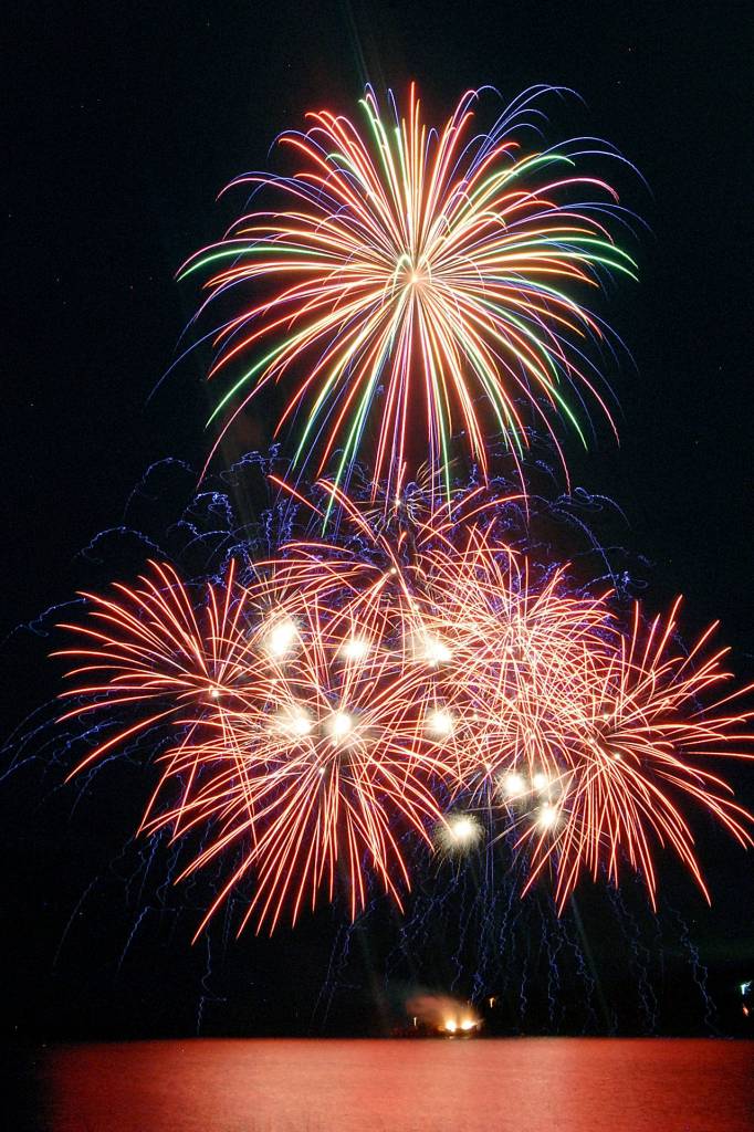 Bursts of fireworks light up the sky over Port Angeles Harbor during Thursdays annual Independence Day display. (Keith Thorpe/Peninsula Daily News)