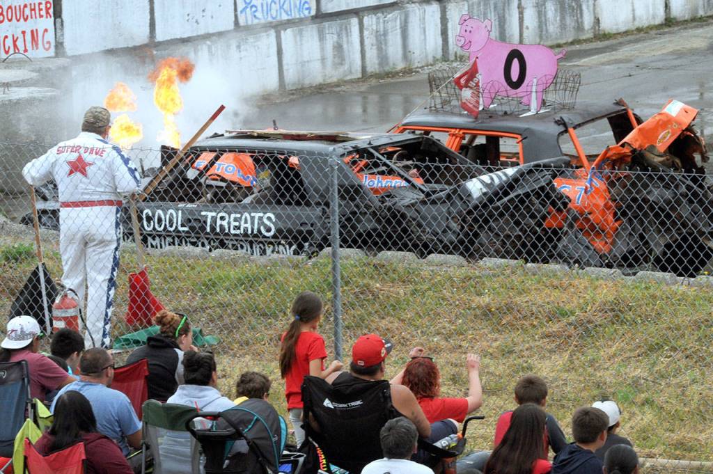 The Cool Treats car driven by Mitch Peterson didnt exactly keep its cool as a few flames were evident Thursday afternoon at Tillicum Park in Forks during the annual Fourth of July Demo Derby. (Lonnie Archibald/for Peninsula Daily News)