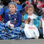 Parade-goers, from left, Amrti Atkinson, 7, Makaylah Bates, 9, Maddi Atkinson, 5, all of Seabeck, and Alexandriah Bates, 5, of Bremerton wait on the curb with candy collection sacks at the start of Thursdays Independence Day parade in Port Angeles. (Keith Thorpe/Peninsula Daily News)