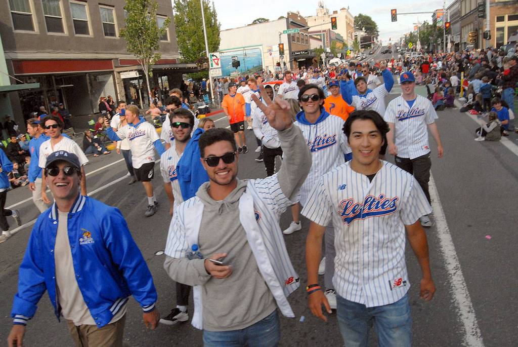 Players for the Port Angeles Lefties take their place in the Port Angeles Independence Day parade on Thursday. (Keith Thorpe/Peninsula Daily News)