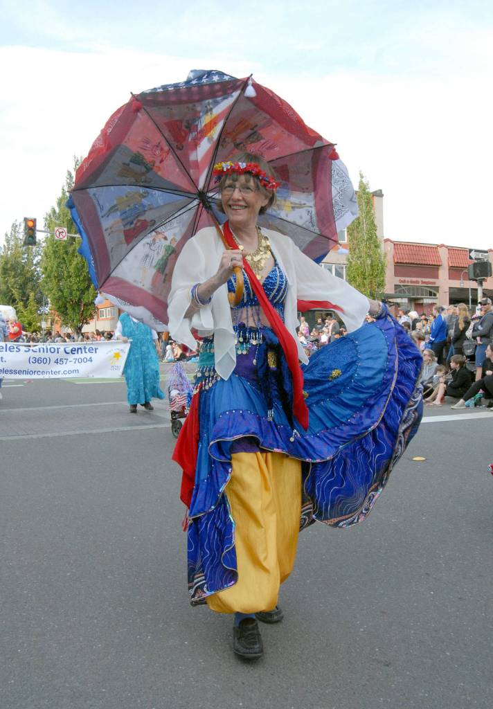 Maria White marches with members of the Port Angeles Senior Center on Thursday. (Keith Thorpe/Peninsula Daily News)