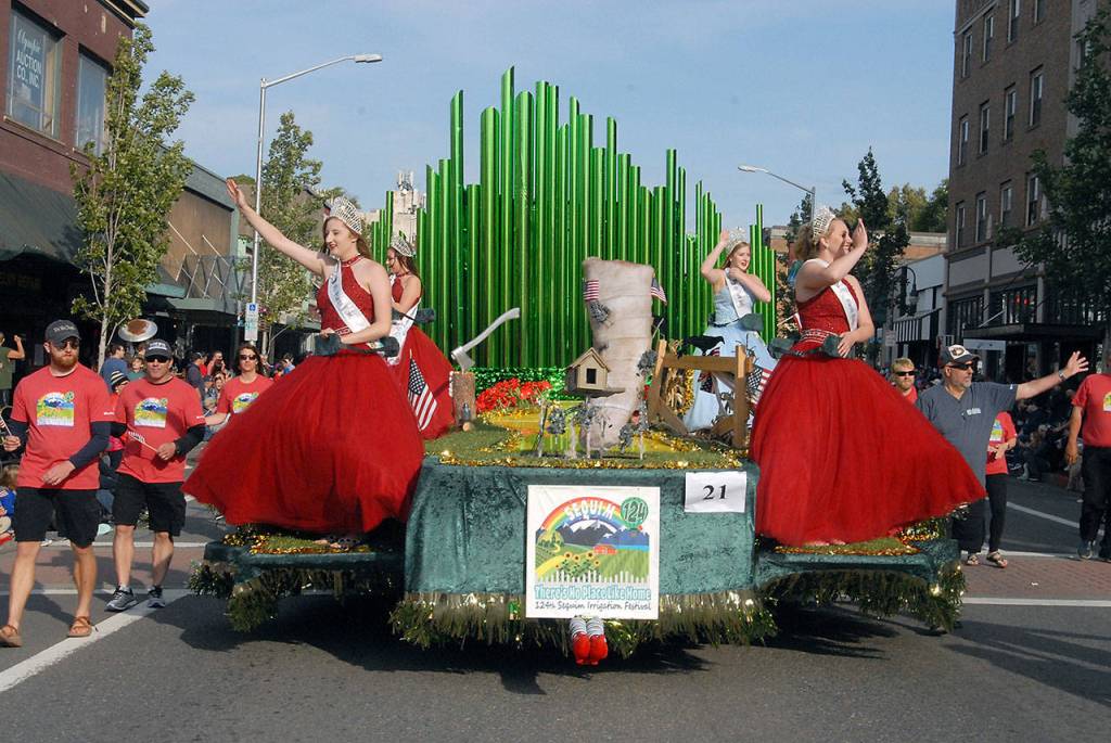 The Sequim Irrigation Festival float carrying festival royalty, from left, princesses Brianna Cowan and Kjirstin Foresman, Queen Emily Silva and Princess Shelby Wells, visits Port Angeles for the Independence Day parade on Thursday. (Keith Thorpe/Peninsula Daily News)