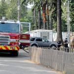 A Port Angeles Fire Department pumper truck keeps station near the scene of Saturdays fatal fire at the Welcome Inn RV Park in Port Angeles. (Keith Thorpe/Peninsula Daily News)