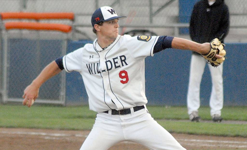 Keith Thorpe/Peninsula Daily News Relief pitcher Carson Ness throws in the fourth inning against Australia Red on Saturday evening at Port Angeles Civic Field.