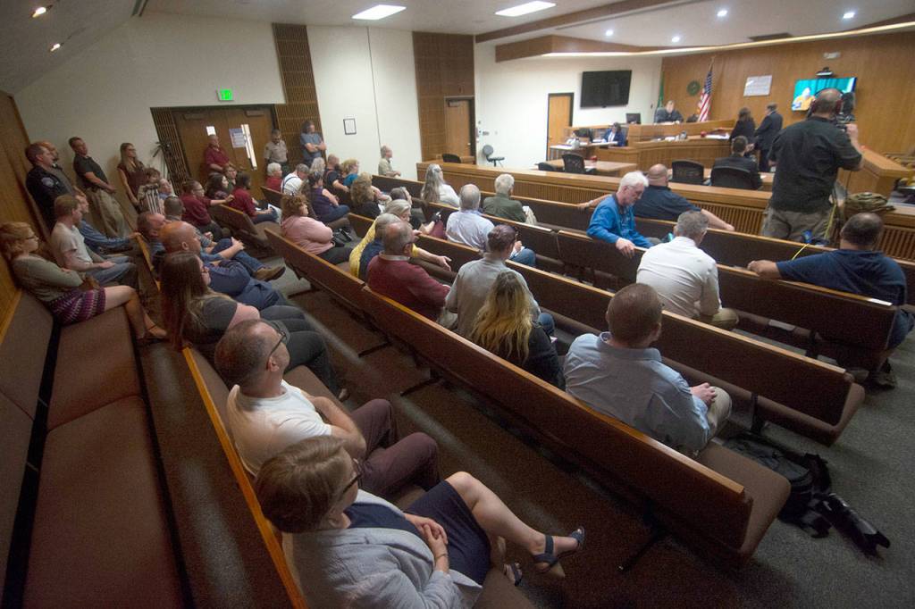 It was standing room only as Matthew Wetherington, accused of killing his wife and her three children, appeared in Clallam County Superior Court on Monday. (Jesse Major/Peninsula Daily News)