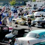 Vintage car enthusiasts mingle among some of the hundreds of automobiles on display at the 2018 Ruddell Auto Cruise-In in Port Angeles. (Keith Thorpe/Peninsula Daily News)