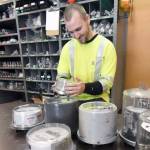 David Elias, Jefferson County PUD supervisory control and date acquisition technician, takes a look at the variety of meters currently being used throughout the county. (Jeannie McMacken/Peninsula Daily News)
