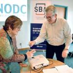Mark Costello, deputy director of the SBAs Seattle district, and Karen Affeld, executive director of the development council, signed a strategic alliance memorandum at a June 27 ceremony at John Wayne Marina.