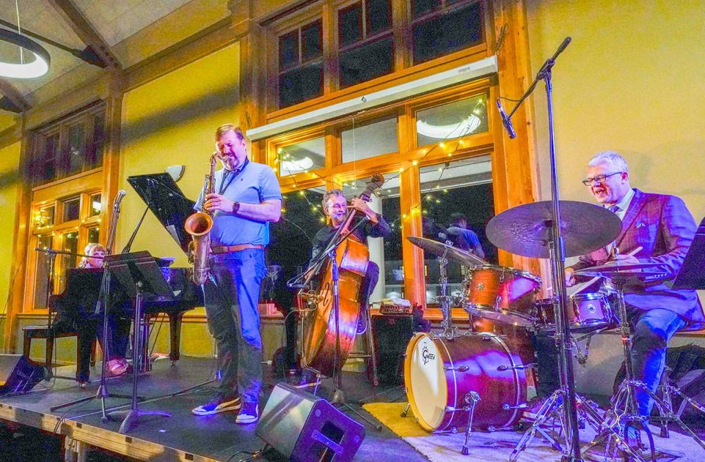 Guest artist Mark Taylor, on sax, joins Matt Wilson on drums with Chuck Deardorf on bass and Dawn Clement on the piano during a Jazz Port Townsend Jazz in the Clubs set at the Commons at Fort Worden State Park on Friday. Jazz Port Townsend continued through Saturday. (Steve Mullensky/for Peninsula Daily News)