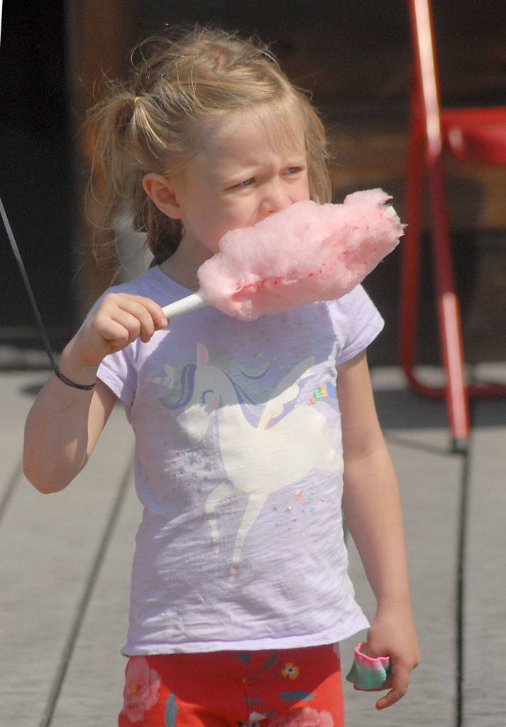 Autumn Long, 4, of Port Angeles enjoys cotton candy on Saturday at Joyce Daze.