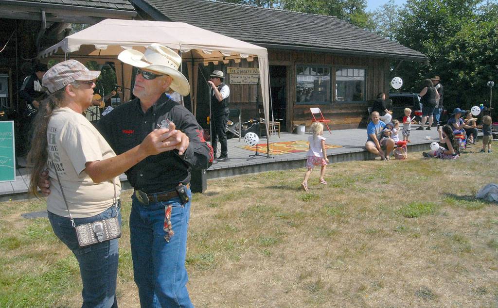 Sandy and Danny Daniel of Joyce dance to the music of The Lovers, one of the musical acts featured at the Joyce Days Wild Blackberry Festival in Joyce.