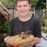 Blackberry pie contest youth catagory winner Nick Ellison of Lewes, England displays his creation after judging.