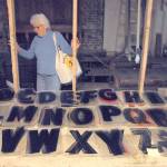 Peggy Norris looks over a collection of marquee letters stored in the balcony of the Lincoln Theater. (Keith Thorpe/Peninsula Daily News)