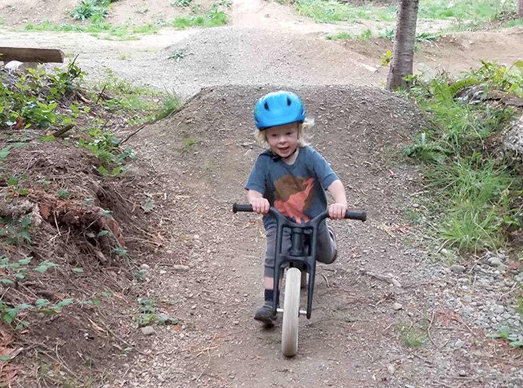 Top Left Trails Co-Op Wolf Schutz-Wade rides his push bike around the pump track at the Colville Mountain Bike Skills Park west of Port Angeles.