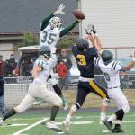 Lonnie Archibald/for Peninsula Daily News Port Angeless Derek Bowechop (35) leaps high to deflect a Forks pass in last seasons season opener. The two area teams will meet at Civic Field on Friday, Sept. 6.