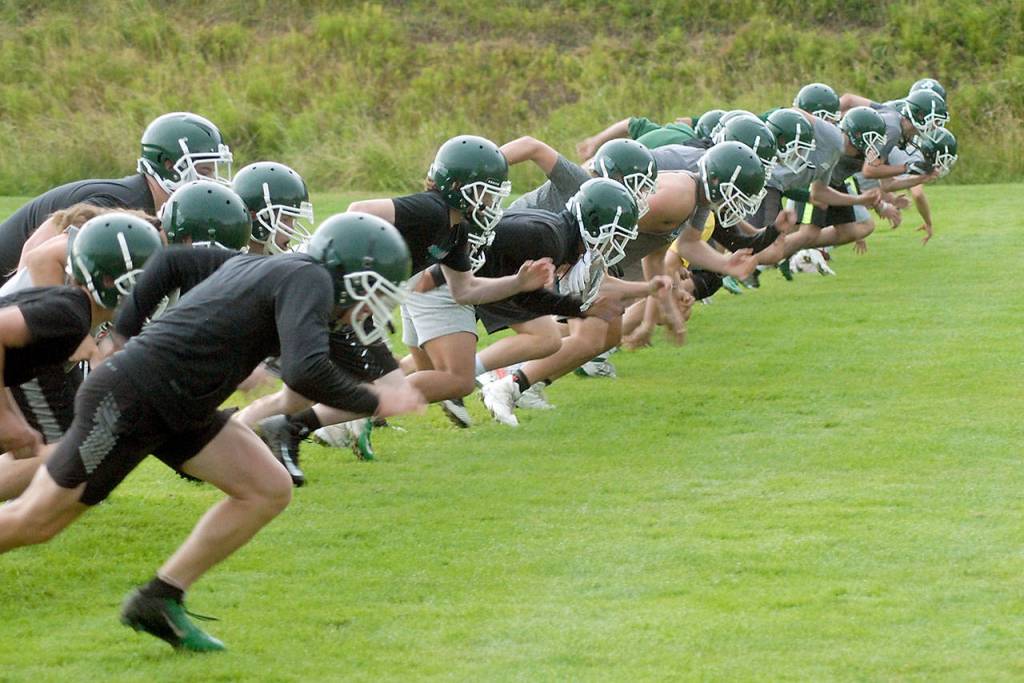 <strong>Keith Thorpe</strong>/Peninsula Daily News                                The Port Angeles football team runs conditioning drills during a preseason practice Friday.
